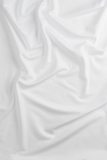 istock white cotton fabric draped, bed linen 1500351343
