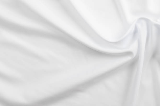 istock white cotton fabric draped, bed linen 1500351362