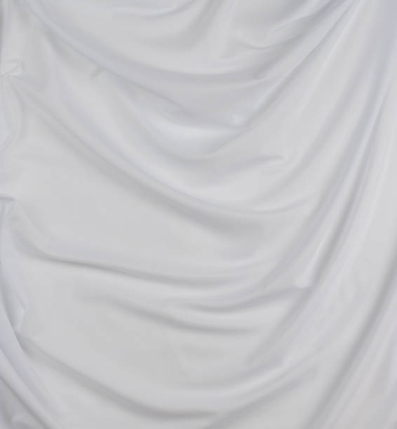 istock white cotton fabric draped, bed linen 1500351450