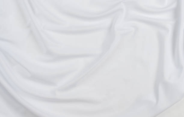 istock white cotton fabric draped, bed linen 1500351454
