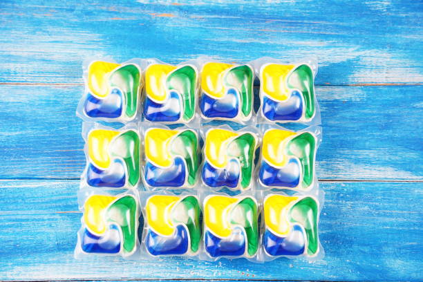 Dishwasher capsules closeup on a  wooden table