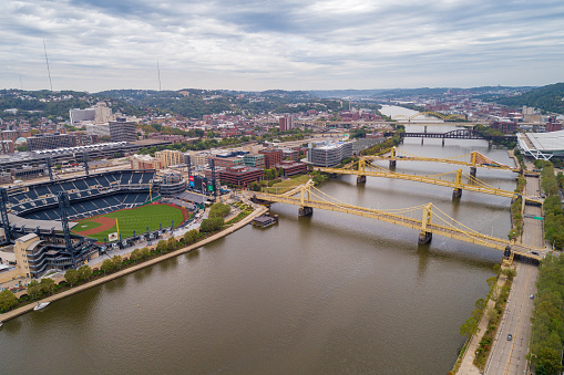 Pittsburgh, Pennsylvania - September 26, 2019: Allegheny River and PNC Park in Pittsburgh, Pennsylvania. Roberto Clemente Bridge, Andy Warhol Bridge, Rachel Carson Bridge in Background