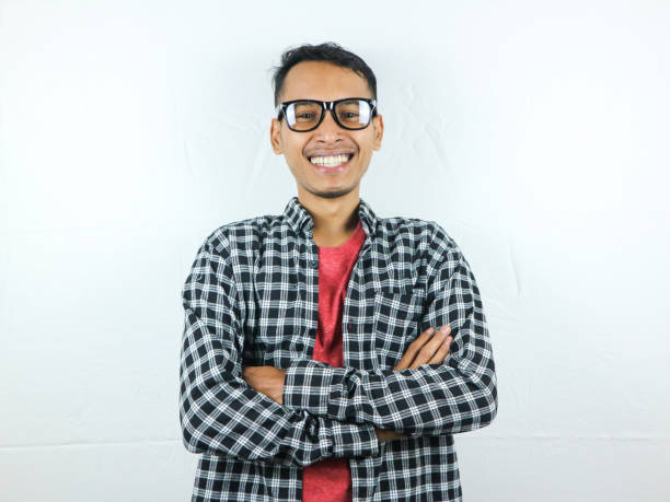 istock Smiling handsome Asian man with arm crossed 1500360858