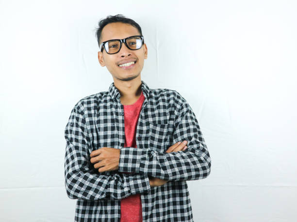 istock Smiling handsome Asian man with arm crossed 1500360864