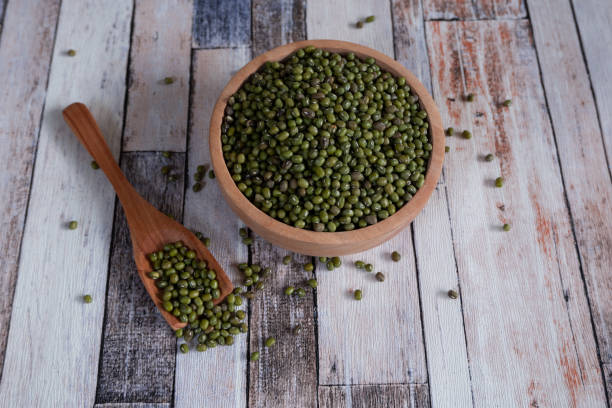 istock Mung bean in wooden bowl and plate. 1500362690