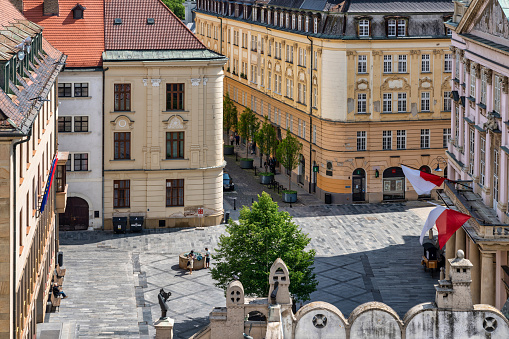 June 21, 2023: Bratislava, Slovaka - A city square in the Old Town of Bratislava. The photo was taken during a warm summer day and contains some people and local shops.