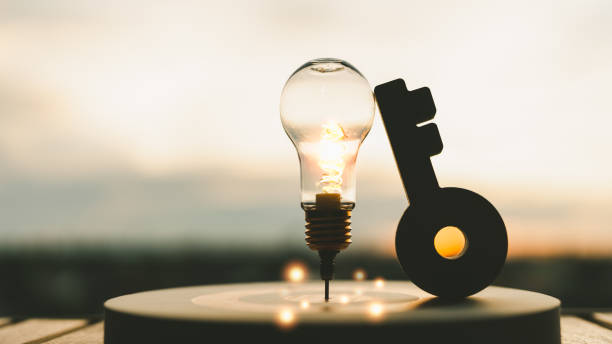 istock Light bulb with arrow of darts on dart board and Key model. Concept of finding problem solving or business development, key to success. 1500366182