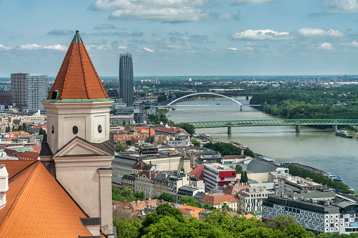 June 21, 2023: Bratislava, Slovaka - The cityscape and skyline of the city. The Bratislava Castle is the main subject in the picture and dominates the city with it's imposing presence.