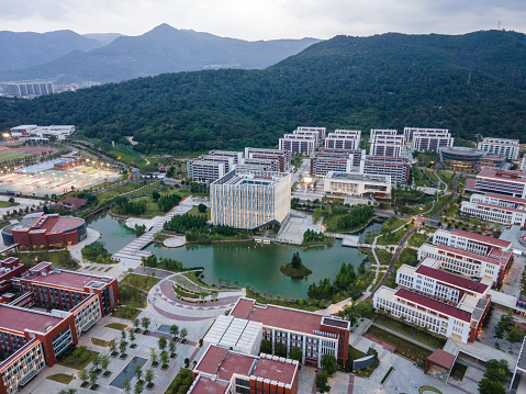 Aerial view of campus buildings and artificial lakes