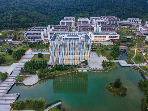 Aerial view of campus buildings and artificial lakes