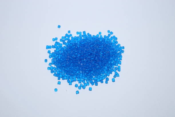 istock Light blue of plastic polymer granules on white background. 1500369492