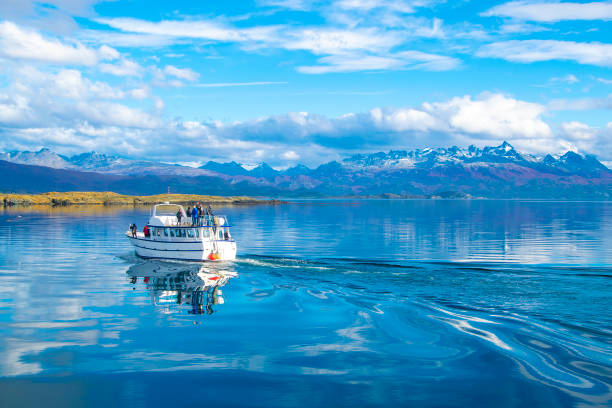 Tour ship sailing at beagle channel, ushuaia, argentina Tourist trip excursion ship sailing at beagle channel, ushuaia, tierra del fuego, argentina beagle channel stock pictures, royalty-free photos & images