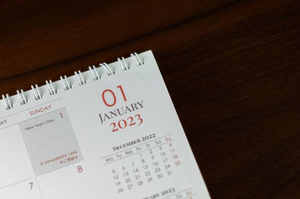 istock a calendar sitting on top of a table with a red tie 1500372998