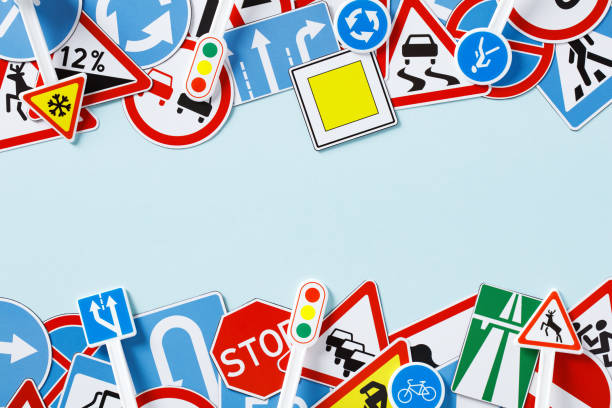 istock Driving school courses banner template. Frame of road signs on light blue background. 1500373086