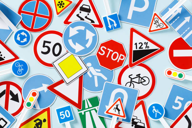 istock Pattern of different road signs on the table. Flat lay, top view. 1500373190
