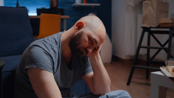 istock Vulnerable depressed man sitting alone feeling emotionally unstable 1500373630