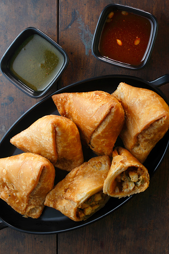 Paneer Chilli Samosa is a delicious Indian snack that combines the flavors of paneer (Indian cottage cheese) and chilli peppers inside a crispy pastry shell.