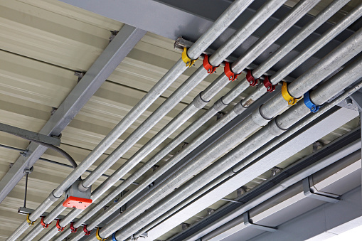 Colored Identification on the Clamps of the Electrical Cable Conduits