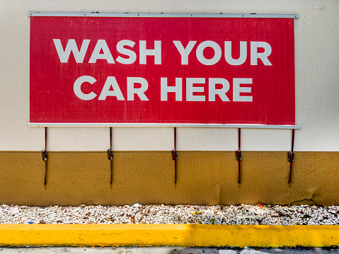 Car wash sign on building wall