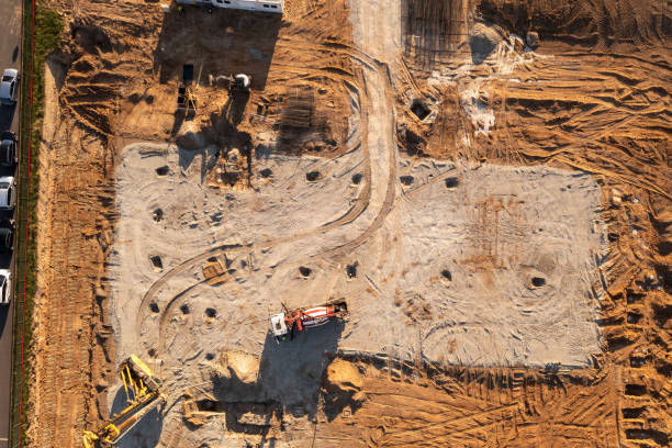 istock Drone footage of constructions site, machinery and people working 1500381673