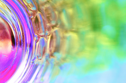 This is a macro focus stacked photograph of the interior of the round bottom of a drinking glass.