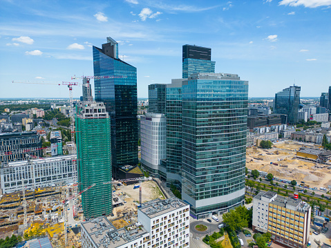 Headquarters of the  Swiss multinational healthcare company Roche. Roche Holding was founded in 1896. The Company has arround 94,000 employees (2017). The image shows the Roche headqurters with the Tower 1(178m) and Tower 2(205m) and several other buildings under construction