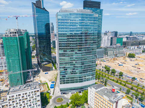 Modern City high rise skyscraper buildings. Aerial drone view of the Financial District Warsaw Daytime