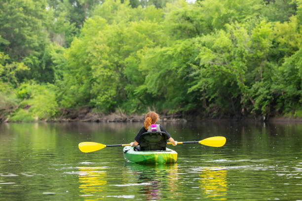 istock Girl Kayaking Down Rum River in Summer 1500385240