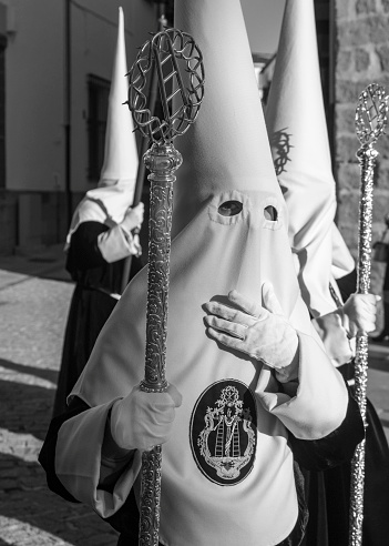 Baeza, Jaen, Spain. 04/06/2023.  Nazarenes with tunic and hood in the processions in the streets of Baeza during the celebration of its traditional Holy Week.