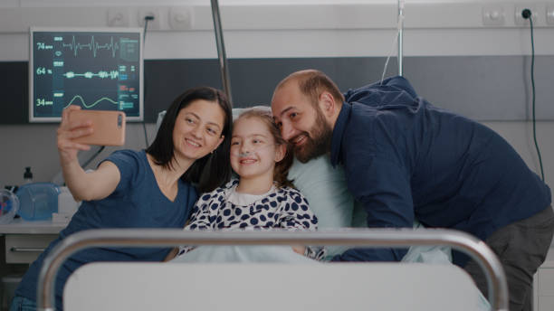 istock Positivity family taking selfie using modern smartphone during disease consultation 1500397394