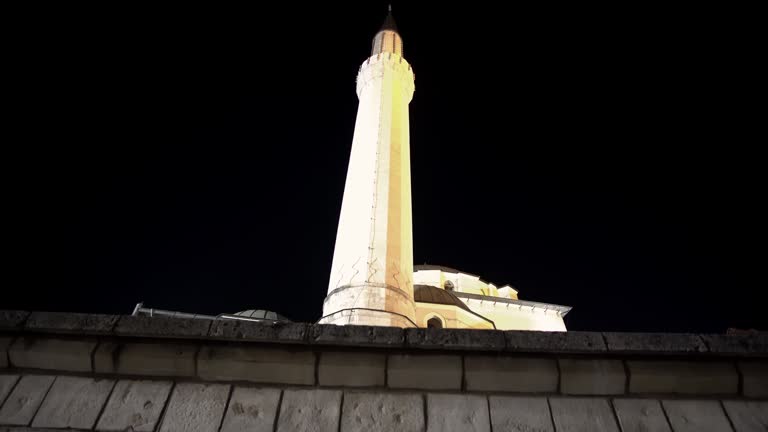 Minaret of the Ottoman-style Emperor's Mosque in Sarajevo at night, it's the first mosque built after the Ottoman conquest of Bosnia in 1457