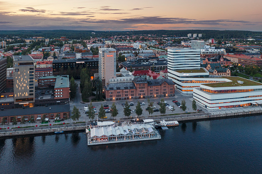 Evening view of downtown Umeå by the Ume river on a summer evening.