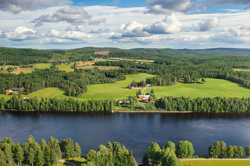 Countryside landscape by the Ume river in the Västerbotten province of Sweden.