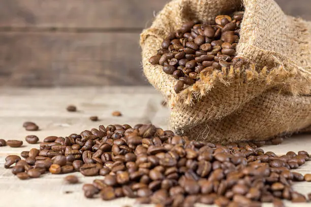 Coffee beans on a wooden background. Copy space. Banner