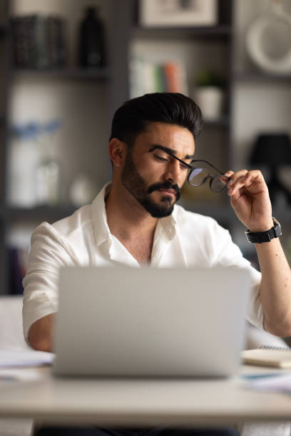 istock Focused businessman sit at workplace desk working on laptop 1500402595