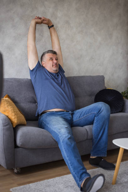 istock Large man resting at home 1500402815