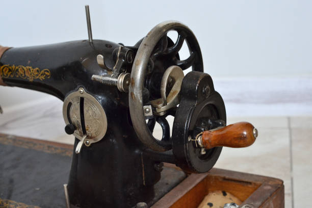 istock old black metal sewing machine on a wooden stand 1500404017