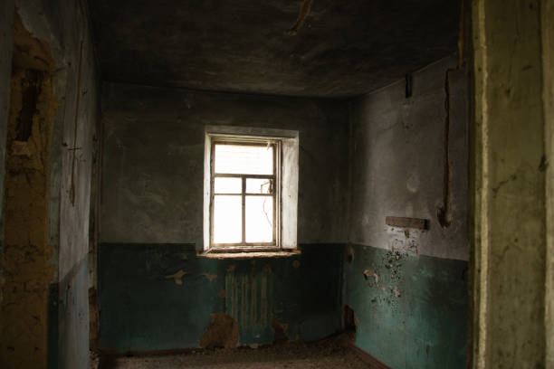 istock old abandoned one-story building dark without windows and doors, destroyed building 1500404412