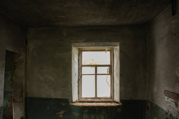 istock old abandoned one-story building dark without windows and doors, destroyed building 1500404451