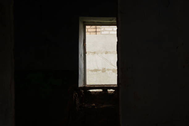 istock old abandoned one-story building dark without windows and doors, destroyed building 1500404466