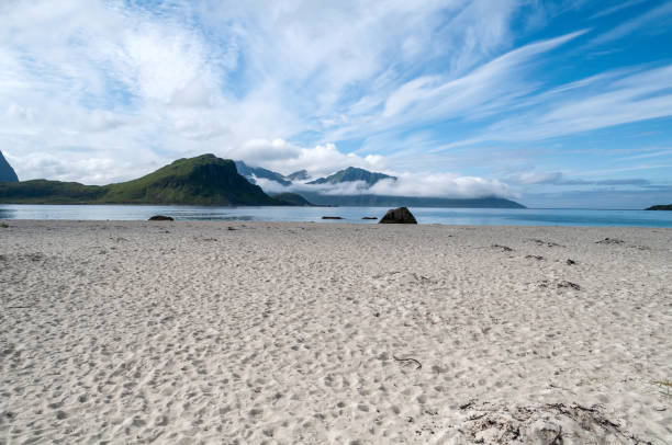 istock Sandy beach with sea and mountains, Lofoten, Norway 1500407093