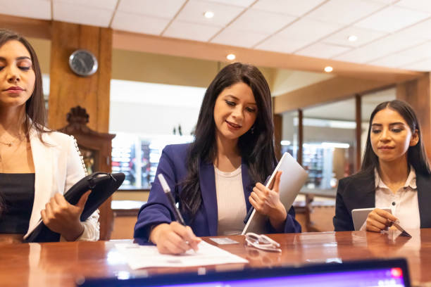 istock Women checking into the hotel 1500407882