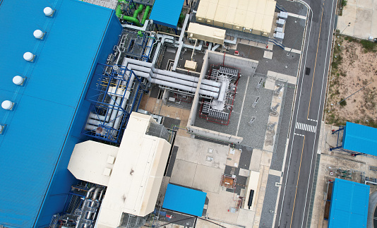 Top view of Electric plants generator from gas and oil send power line to Town, Aerial view of a huge power plant on the industrial estate in Thailand