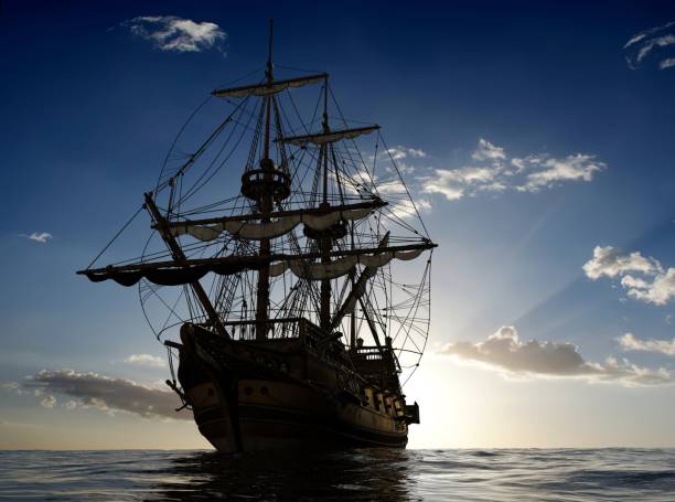 istock Silhouette of a beautiful large pirate ship on a sea surface 1500409568