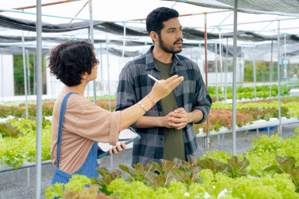 istock Organic farm owner doing business with young man 1500411457