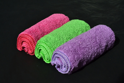 multi-colored rags lie on a black background