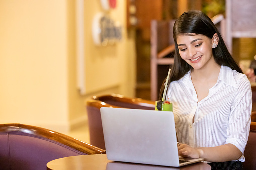 Young woman in business working on her computer