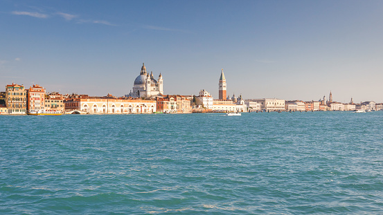 Giudecca canal in Venice with the Santa Maria della Salute basilica and St. Mark's Campanile tower, Italy, Europe.