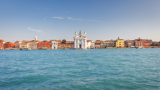 Venice, Italy - March 28th, 2018: Gondolas on the pier in Venice