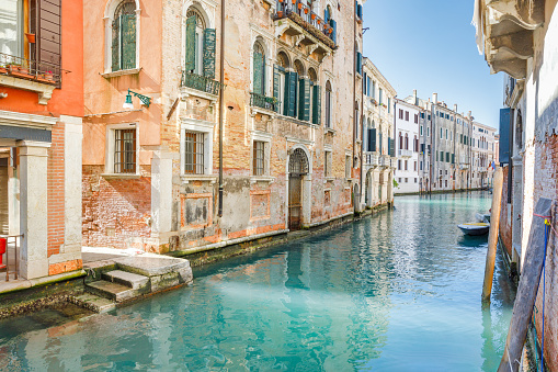 Canal with historic buildings in Venice, Italy, Europe.